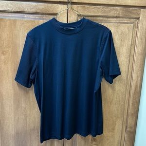 Men’s black pullover shirt. Made by Tom James size is extra large.